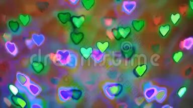 闪烁五颜六色的花环，形状像心形，用作情人节的背景，霓虹灯效果